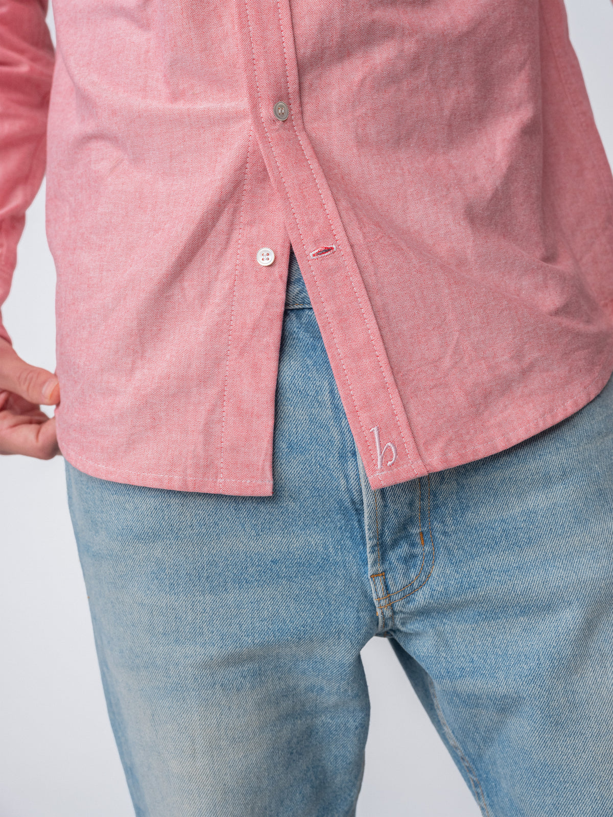 close up detail of guy wearing Hanover Essential Oxford Shirt in Red on model