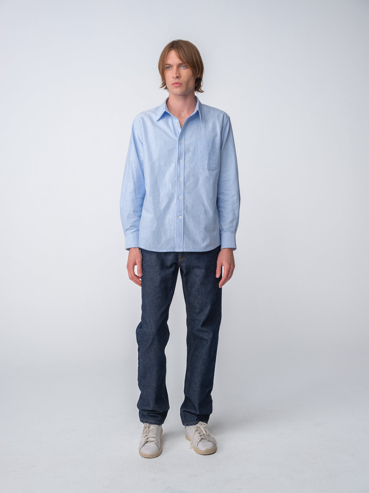 Full body guy wearing Hanover Essential Oxford Shirt in Blue on model