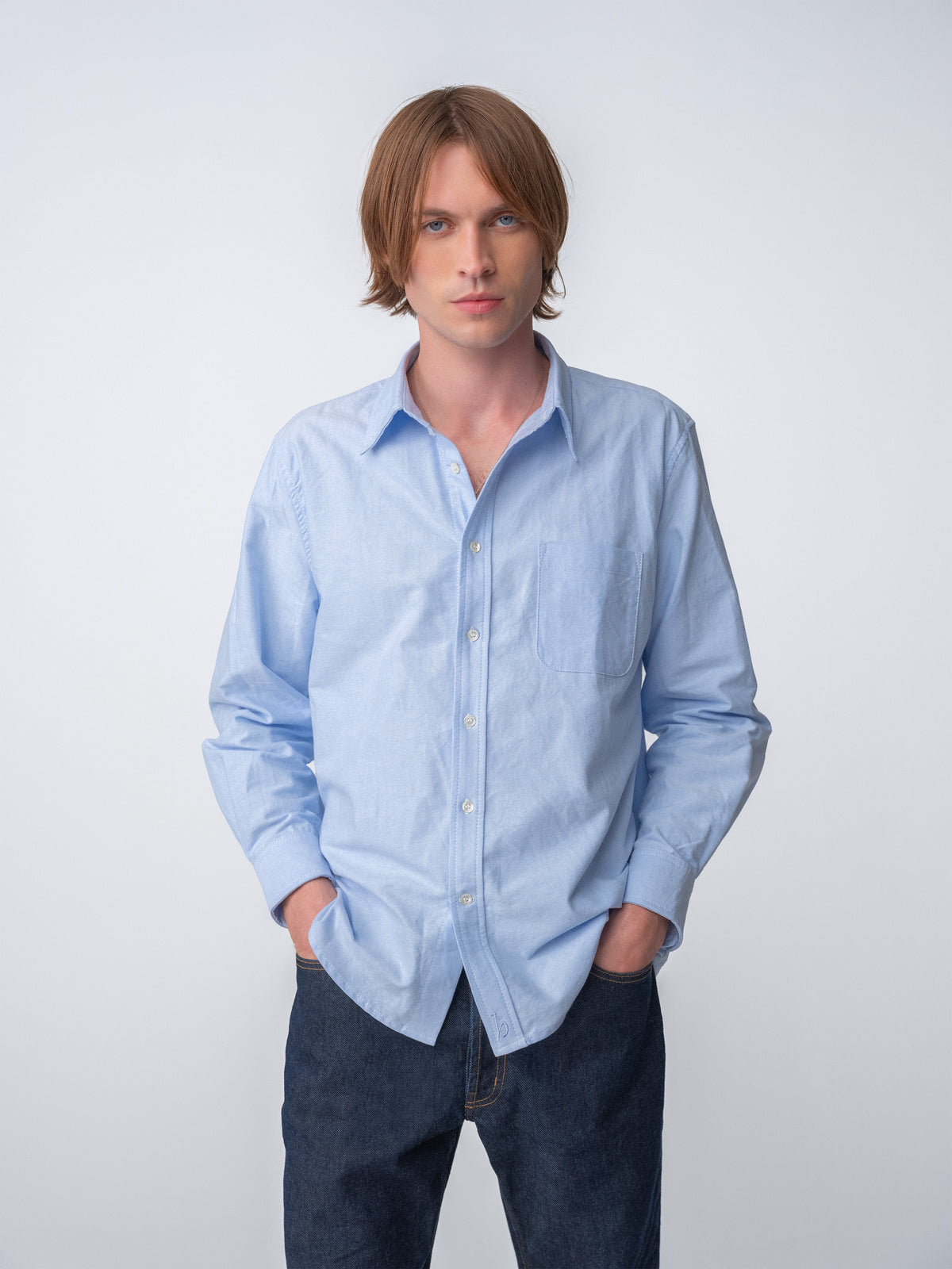 Guy wearing Hanover Essential Oxford Shirt in Blue on model