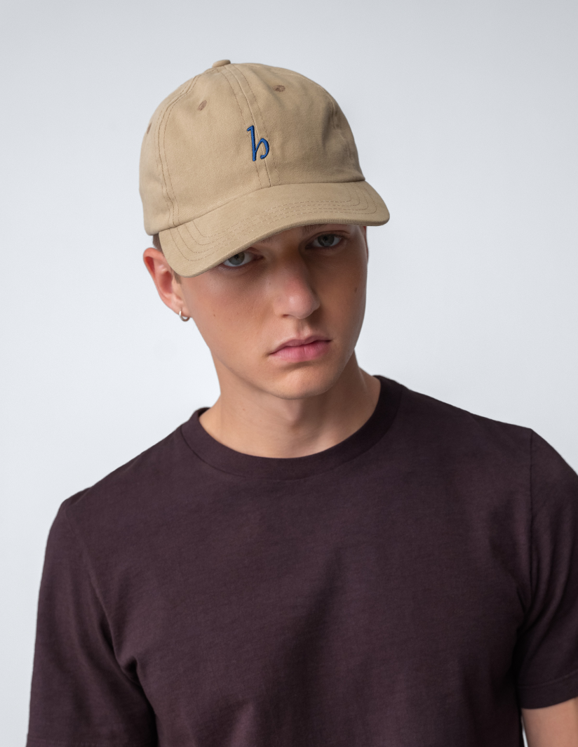 Hanover Cap worn by a model, showcasing the cotton twill design and embroidered logo.