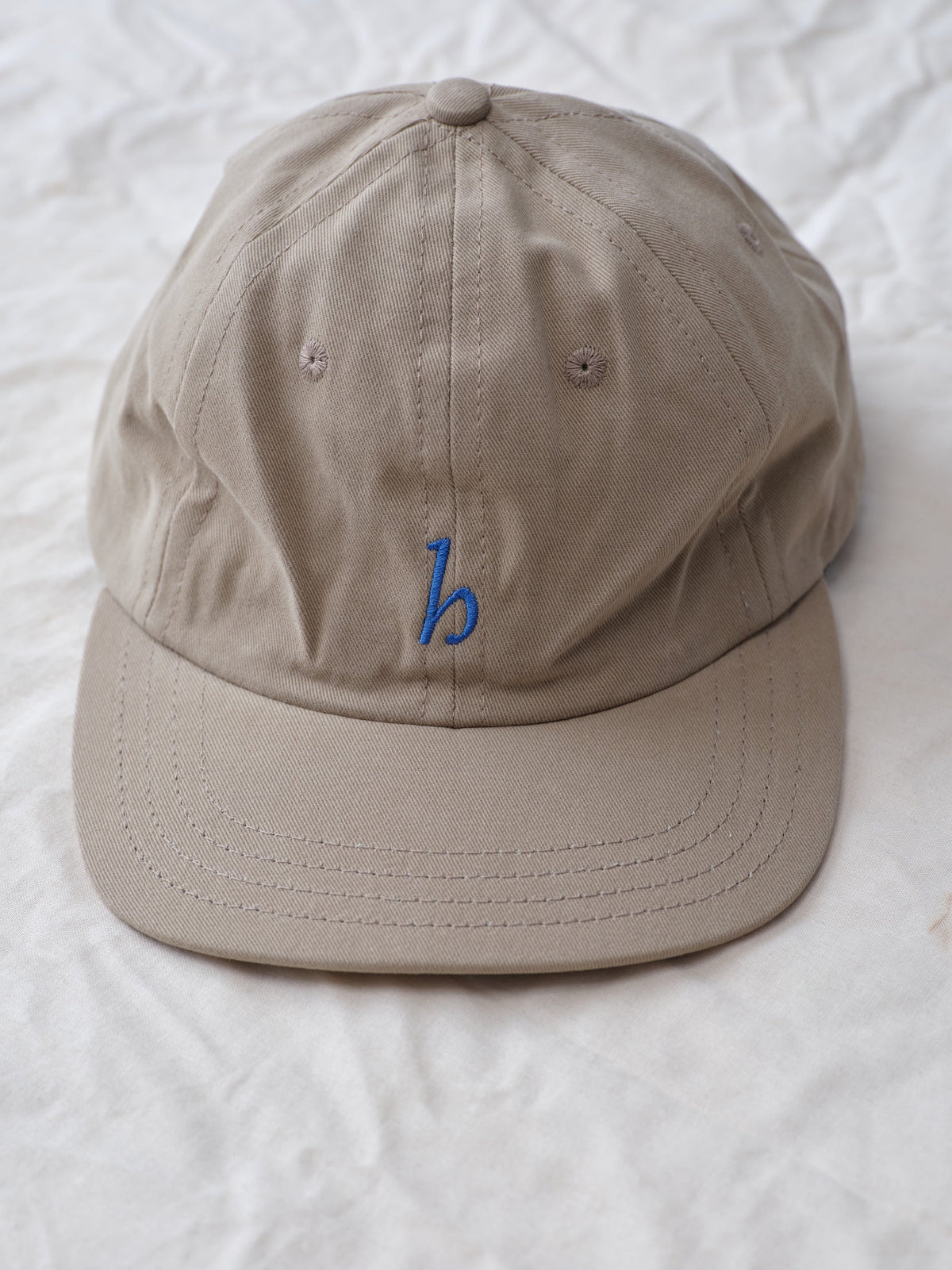 Hanover cap in khaki on textured background