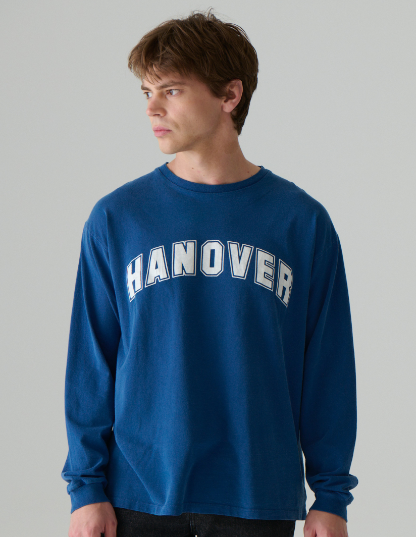 Model wearing a mid navy Hanover Long Sleeve Tee 