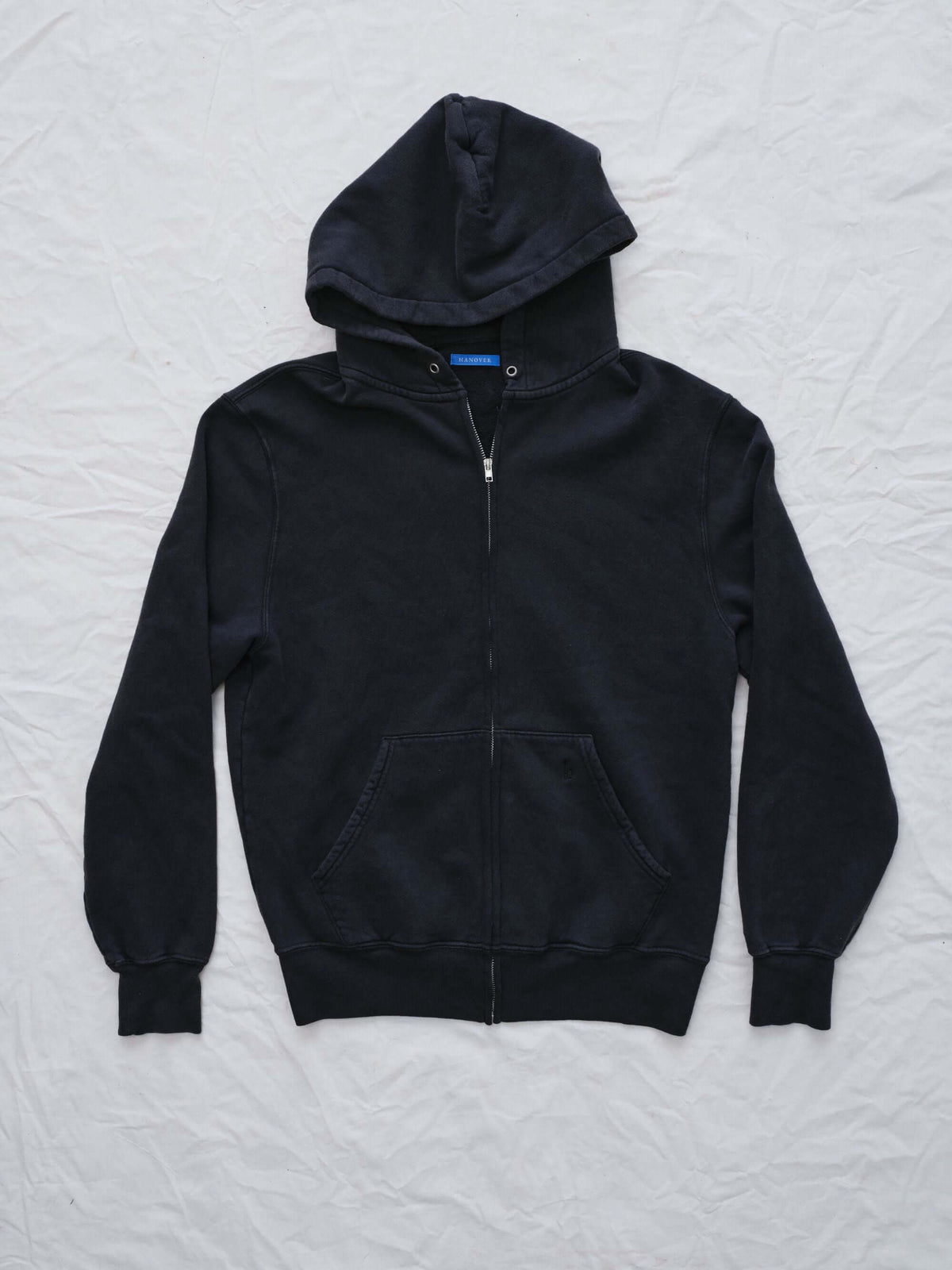 Hanover vintage Black hoodie on a textured white background