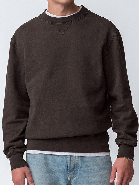 Guy wearing Sunwashed Staple Crewneck in cacao torso view