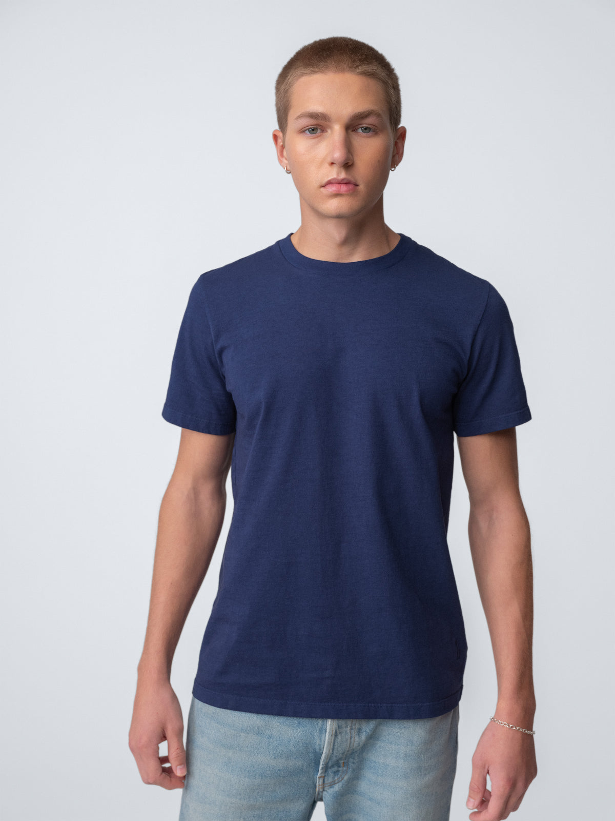 Model guy wearing Staple T-Shirt in true black torso view
