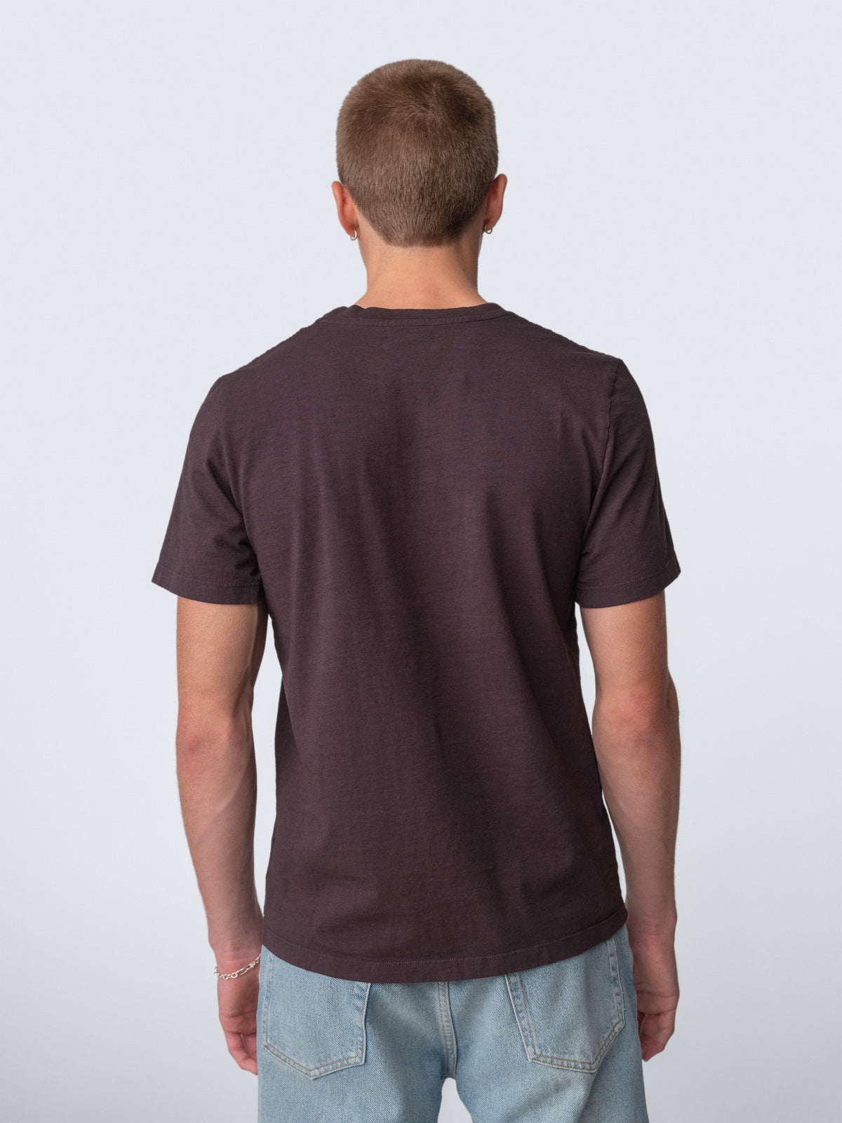 Model guy wearing Staple T-Shirt in cacao back view