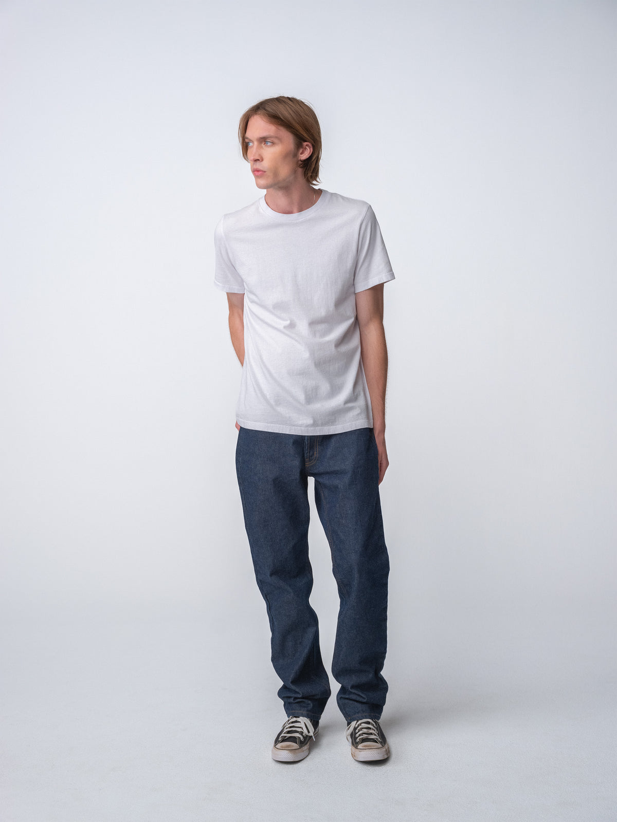 Model guy wearing Staple T-Shirt in white full body view