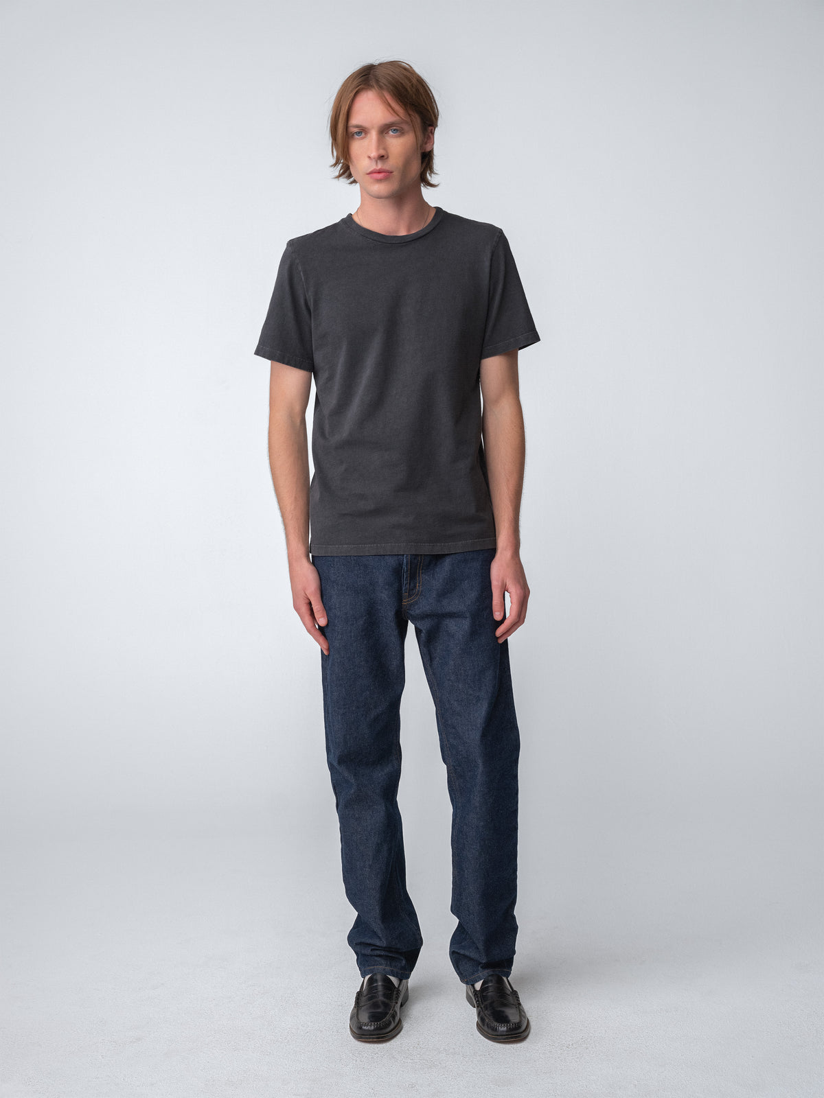 Model wearing Sunwashed Staple T-Shirt in charcoal full body view
